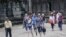 FILE: A tour guide leads a group of tourists at Angkor Wat Temple in Siem Reap province, Cambodia, Saturday, July 16th, 2016. ( Leng Len/VOA Khmer)