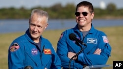 NASA astronauts Doug Hurley, left, and Bob Behnken answer questions during a news conference before the Falcon 9 SpaceX Crew Demo-1 rocket launch at the Kennedy Space Center in Cape Canaveral, Fla., Friday, March 1, 2019. (AP Photo/John Raoux)