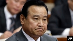 South Korea's new Prime Minister nominee Lee Wan Koo listens to a question during a confirmation hearing in order to examine his qualification at the National Assembly in Seoul, South Korea, Tuesday, Feb. 10, 2015.