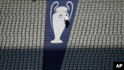 FILE - A security official walks past a Champions League trophy logo during an Inter Milan training session at the Ataturk Olympic Stadium in Istanbul, Turkey, June 9, 2023.