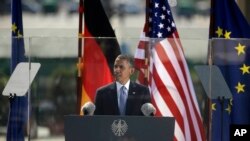 U.S. President Barack Obama speaks in front of the iconic Brandenburg Gate, in Berlin, Germany, June 19, 2013.