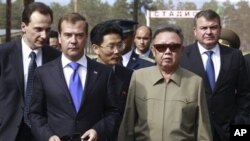North Korean leader Kim Jong Il, second right, and Russian President Dmitry Medvedev, second left, during a meeting an a military garrison, outside Ulan-Ude, Wednesday, Aug. 24, 2011