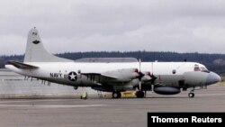 FILE - An U.S. Navy EP-3E Aries II electronic spy turborprop airplane sits on the tarmac.
