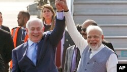 The body of a young man is seen covered with an emergency blanket after being recovered by Spanish police from waters near the border between Morocco and Spain&#39;s north African enclave of Ceuta.