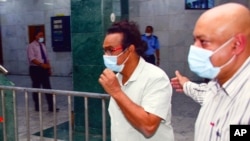 Sunil Kumar Nandeshwar, captain of the MV Wakashio, a bulk carrier ship that recently ran aground off the southeast coast of Mauritius, is seen outside the courthouse in Port Louis, Aug. 18, 2020.