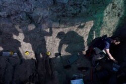 Exhumation of a mass grave of Eugenio Insua, who is one of 17 people who were killed by the forces of dictator Francisco Franco in July 1936, at the El Espinar cemetery, Spain, Sept. 3, 2020.