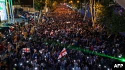 Demonstrators protesting the "foreign influence" law stage a march toward the Georgian Interior Ministry with the demand to release detained fellow protesters, in Tbilisi on May 24, 2024.