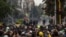 Riot police and demonstrators face off during a national protest against tax reform in Bogotá, Colombia, April 28, 2021. (Pu Ying Huang/VOA)