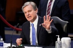 Direktur FBI Christopher Wray bersaksi di hadapan Komite Kehakiman Senat di Capitol Hill di Washington, 2 Maret 2021. (Foto: AP)