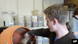 Nate Winkler adds some spices to a mate blend at Oregon Yerba Mate in Redmond, Oregon