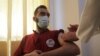 A man receives a dose of the coronavirus vaccine at a hospital in Idlib, Syria, May 1, 2021. 