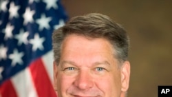 This photo provided by the Department of Justice shows Timothy Shea, currently senior counselor to Attorney General William Barr.