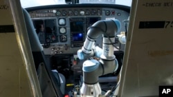 Aurora Flight Sciences' Aircrew Labor In-Cockpit Automantion System (ALIAS), is mounted in the co-pilot seat of a Cessena Caravan aircraft at Manassas Airport in Manassas, Va., Monday, Oct. 17, 2016. 