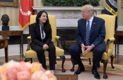 President Donald Trump meets with Aya Hijazi, an Egyptian-American aid worker, in the Oval office of the White House in Washington, April 21, 2017.