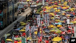 Thousands of protesters march along a downtown street against the extradition law in Hong Kong, April 28, 2019. 