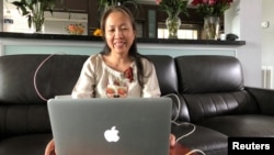 Vietnamese blogger-activist Mother Mushroom speaks with a reporter during a video conference on her laptop in Houston, Texas. 
