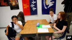FILE - Students attend an eight grade class at Southside Middle School in Denham Springs, La.