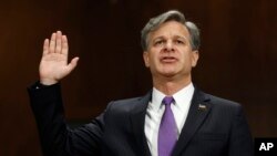 FBI Director nominee Christopher Wray is sworn-on on Capitol Hill in Washington, July 12, 2017, prior to testifying at his confirmation hearing before the Senate Judiciary Committee. 