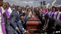 Family and friends carry the coffin during the burial of late Kenyan marathon runner Kelvin Kiptum in Chepkorio on Feb. 23, 2024.