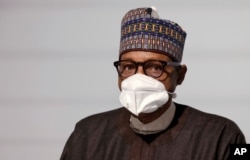 FILE - Nigeria's President Muhammadu Buhari attends the opening session at the Summit on the Financing of African Economies, in Paris, May 18, 2021.