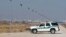 FILE - A U.S. Border Patrol truck sits at the U.S.-Mexico border in El Paso, Texas. 