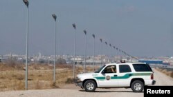 FILE - A U.S. Border Patrol truck sits at the U.S.-Mexico border in El Paso, Texas. 