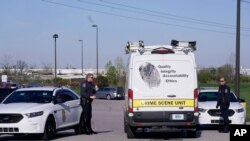 A crime scene vehicle arives where multiple people were shot at the FedEx Ground facility early Friday morning, April 16, 2021, in Indianapolis. 