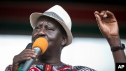 Kenyan opposition leader Raila Odinga addresses his supporters during a rally in the Uhuru Park in Nairobi, Kenya, Oct. 25, 2017.