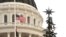 Flags fly at half staff at the Capitol, in Sacramento, California, to honor the victims of a mass shooting in San Bernardino, Dec. 2, 2015.