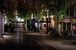 A shopping street in Bonn is empty at the beginning of a month-long COVID-19 lockdown in Germany, Nov. 2, 2020.