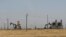 FILE - An oil field controlled by the Kurdish-led Syrian Democratic Forces (SDF) is seen northeast Syria, July 30, 2017.