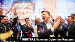 Ukrainian presidential candidate Volodymyr Zelenskiy reacts following the announcement of the first exit poll in a presidential election at his campaign headquarters in Kyiv, April 22, 2019.