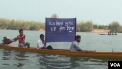 Villagers living along the Sesan river in northeastern Cambodia protest the construction of the Sesan 2 dam in March 2013. The construction of the hydropower dam would force as many as 1,500 families to resettle.