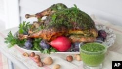 This Sept. 29, 2014, photo shows herb roasted Thanksgiving turkey in Concord, N.H. (AP Photo/Matthew Mead)