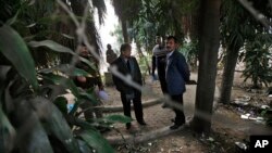 Indian investigators visit a spot which police say is where a Danish tourist was gang-raped in New Delhi, Jan. 15, 2014.