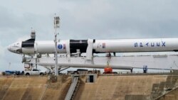 The SpaceX Falcon 9, with Dragon crew capsule is serviced on Launch Pad 39-A, Tuesday, May 26, 2020, at the Kennedy Space Center in Cape Canaveral, Fla. Two astronauts will fly on the SpaceX Demo-2 mission to the International Space Station.