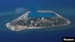 FILE - An aerial view of Southwest Cay, also known as Pugad Island, controlled by Vietnam and part of the Spratly Islands in the disputed South China Sea, April 21, 2017.
