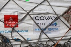 A shipment of COVID-19 vaccines from the COVAX global COVID-19 vaccination program arrives at the Kotoka International Airport in Accra, Ghana, Feb. 24, 2021.