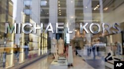 FILE- Michael Kors name adorns his store on Madison Avenue, in New York, May 31, 2017.