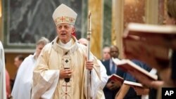 FILE - Cardinal Donald Wuerl, Archbishop of Washington, enters church for Mass at St. Mathews Cathedral, Wednesday, Aug. 15, 2018 in Washington. (AP Photo/Kevin Wolf)