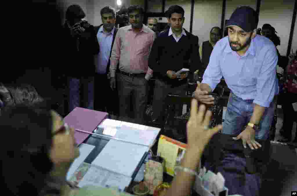 Uber’s General Manager for Delhi region Gagan Bhatia speaks to the Chairperson of Delhi Commission for Women Barkha Singh after being summoned by the commission in New Delhi, India, Tuesday, Dec. 9, 2014.