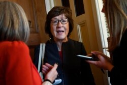 FILE - Sen. Susan Collins, R-Maine, talks to reporters on Capitol Hill in Washington.