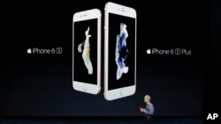 Apple CEO Tim Cook discusses the new iPhone 6s and iPhone 6s Plus during the Apple event at the Bill Graham Civic Auditorium in San Francisco, Wednesday, Sept. 9, 2015. (AP Photo/Eric Risberg)