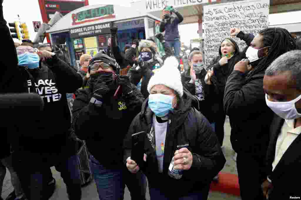 People react after the verdict in the trial of former Minneapolis police officer Derek Chauvin, found guilty of the death of George Floyd, at George Floyd Square in Minneapolis, April 20, 2021.