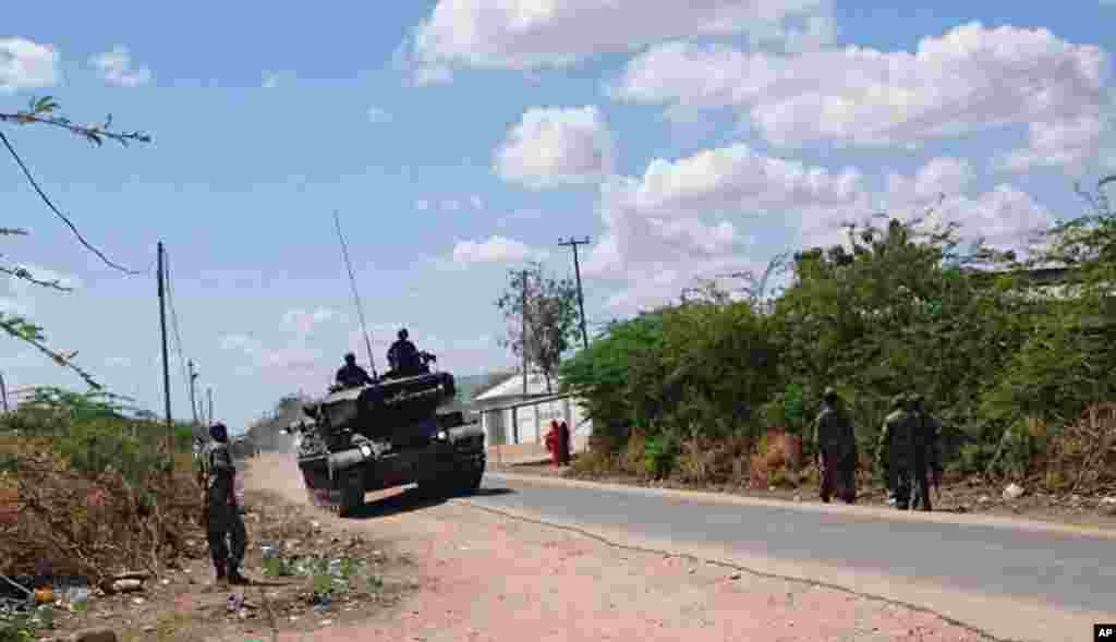 A Kenyan Defense Forces tank travels on a road outside Garissa University College in Garissa, Kenya, April 2, 2015. 