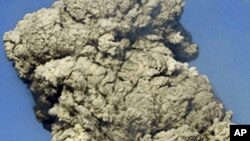 FILE - White smoke raises from Mount Shinmoedake in Kirishima mountain range in Kagoshima prefecture, Japan's southern island of Kyushu.