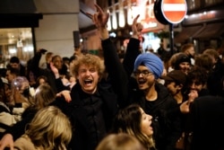 People drink in the Soho area of London, on April 12, 2021, as coronavirus restrictions are eased across the country in step two of the government's roadmap out of England's third national lockdown.