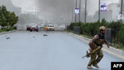 Yemenis present documents in order to receive food rations provided in Sana&#39;a, Yemen.