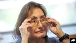 FILE - Connie Culp, who underwent the first face transplant surgery in the U.S., talks to a reporter at the Cleveland Clinic, Sept. 14, 2010, in Cleveland. Culp died July 29, 2020, of complications from an infection unrelated to her transplant.