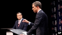 FILE - Republican U.S. Senator Ted Cruz (L) and Democratic U.S. Representative Beto O'Rourke take part in their first debate for the Texas U.S. Senate in Dallas, Sept. 21, 2018. 